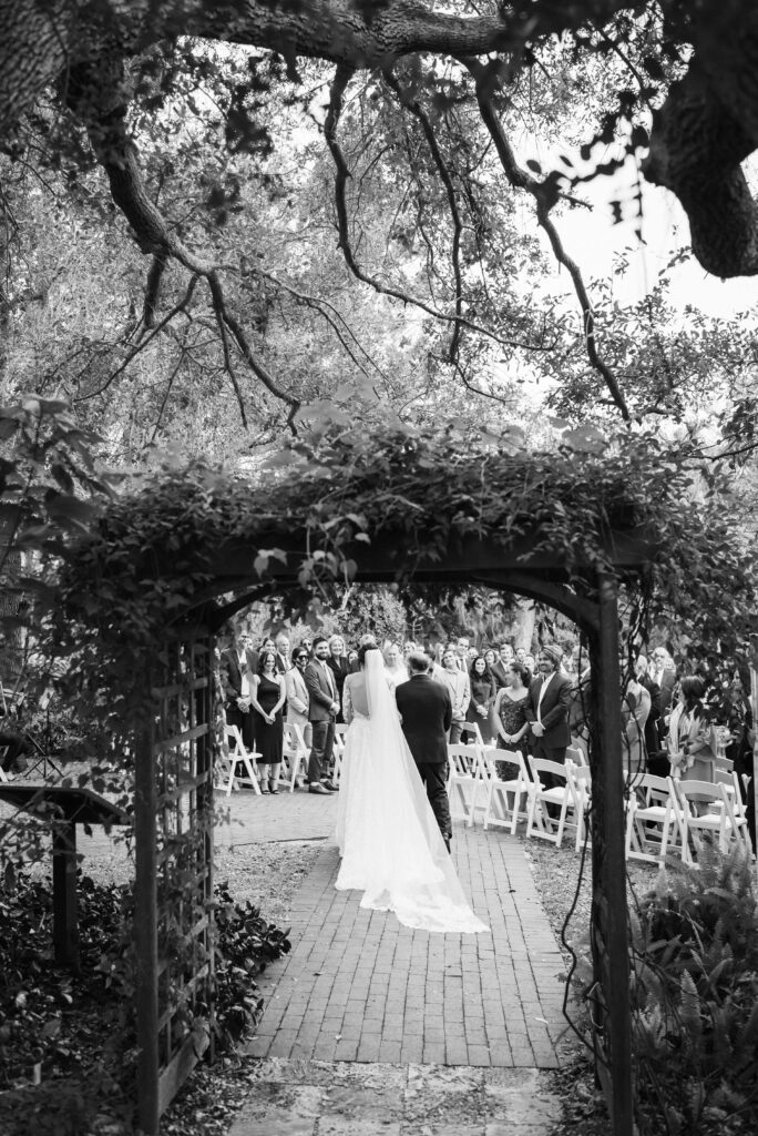 Outdoor wedding ceremony at the Marie Selby Botanic Gardens in Sarasota, Florida. Photo by OkCrowe Photography.