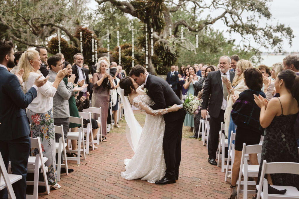 Outdoor wedding ceremony at the Marie Selby Botanic Gardens in Sarasota, Florida. Photo by OkCrowe Photography.