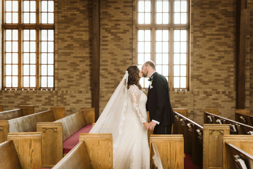 Bride and groom first look in the Alumni Chapel of the Baylor School in Chattanooga. Photo by OkCrowe Photography.