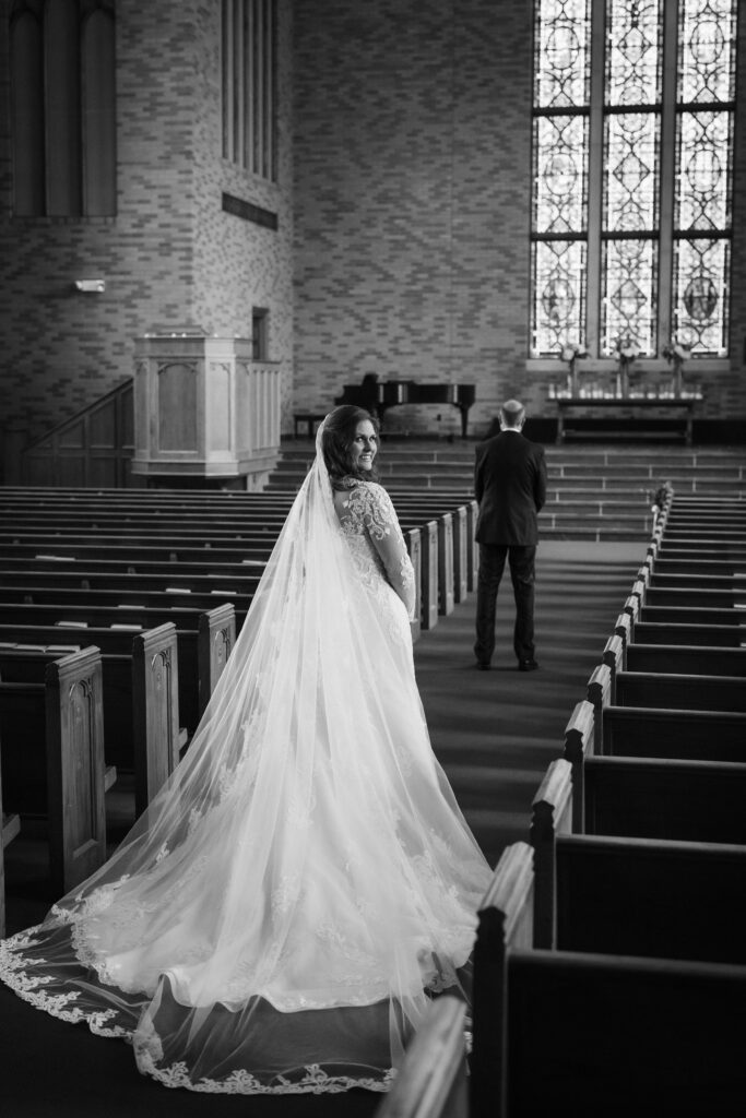 Bride and groom first look in the Alumni Chapel of the Baylor School in Chattanooga. Photo by OkCrowe Photography.