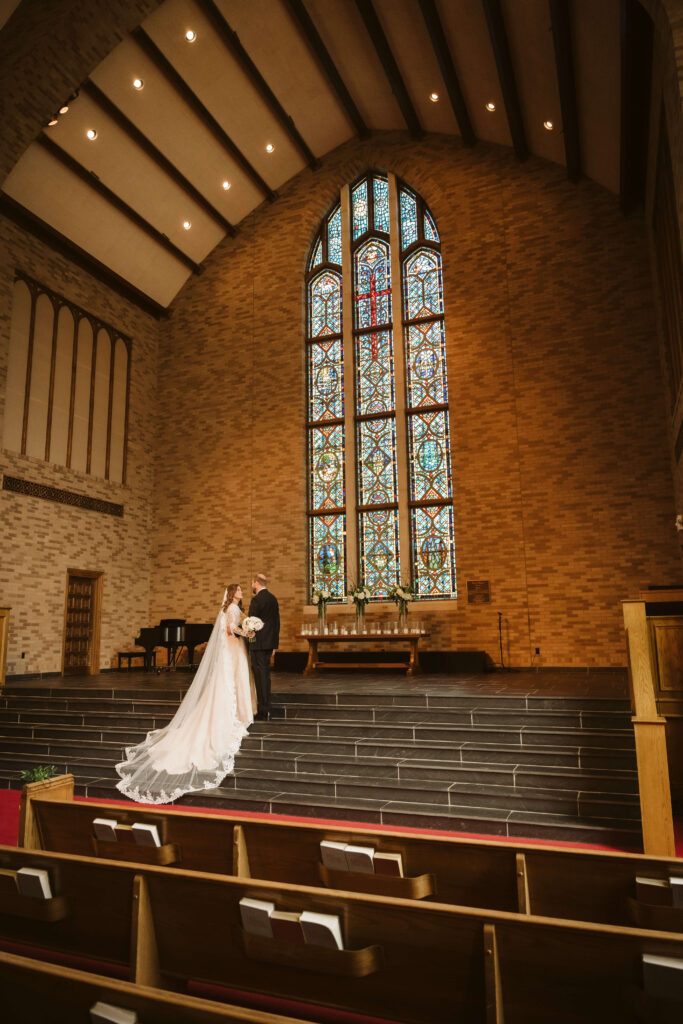 Bride and groom portraits in the Alumni Chapel of the Baylor School in Chattanooga. Photo by OkCrowe Photography.