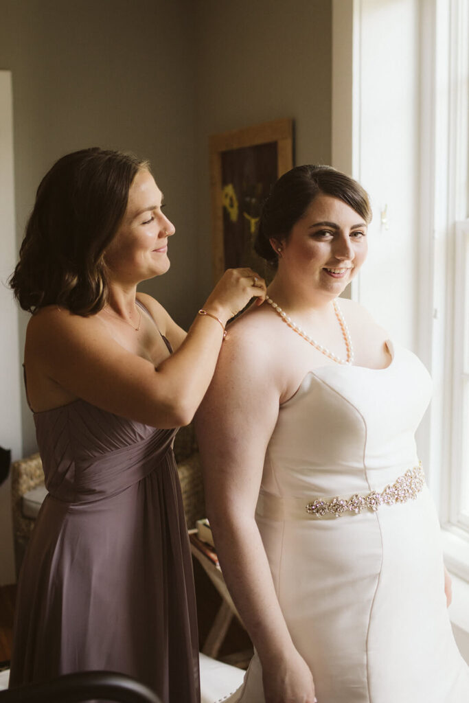 Bride and bridesmaids getting ready for a wedding at the Hunter Museum in Chattanooga. Photo by OkCrowe Photography. 