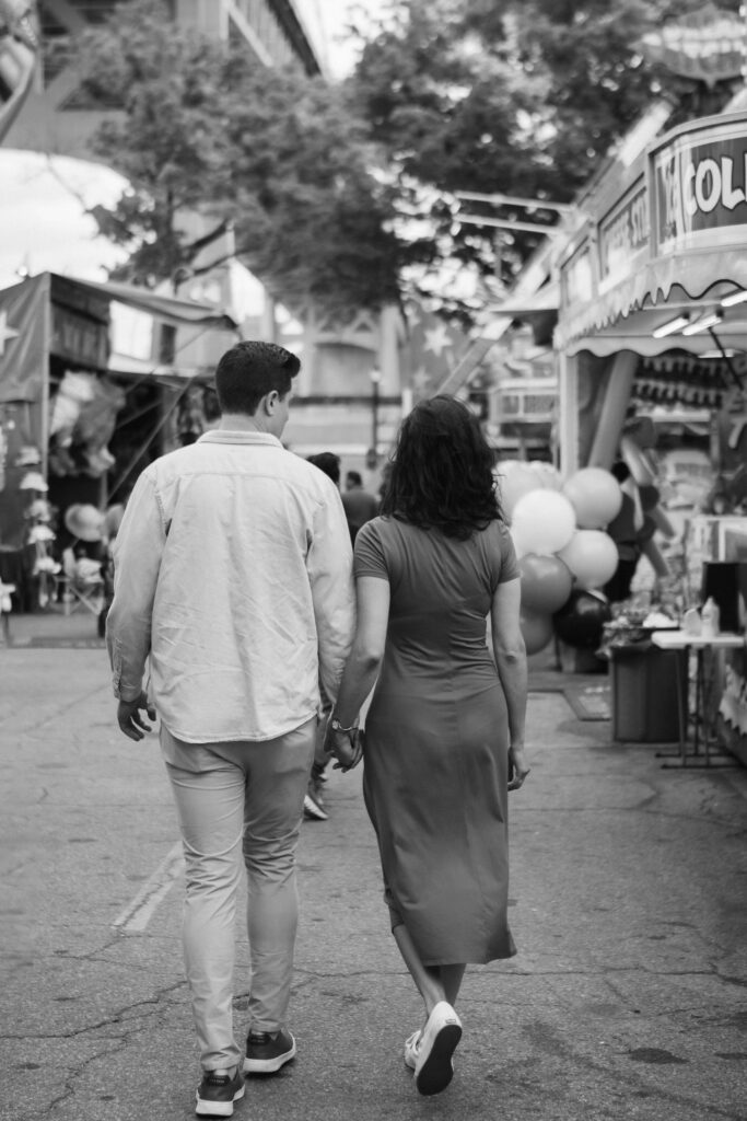 Fun engagement session at the Astoria Park Carnival. Photo by OkCrowe Photography.