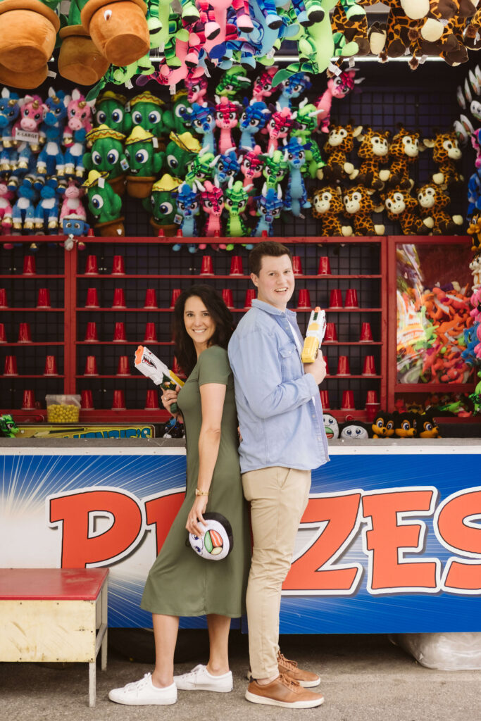 Fun engagement session at the Astoria Park Carnival. Photo by OkCrowe Photography.