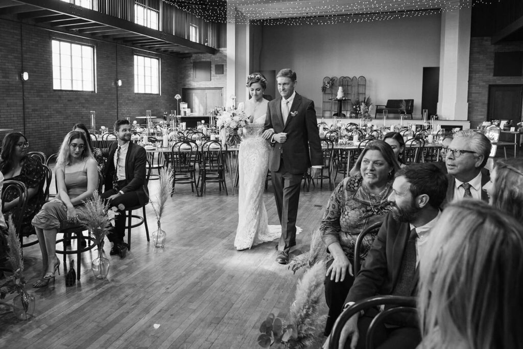 Wedding ceremony in Ruby Hall at the Common House Chattanooga. Photo by OkCrowe Photography.