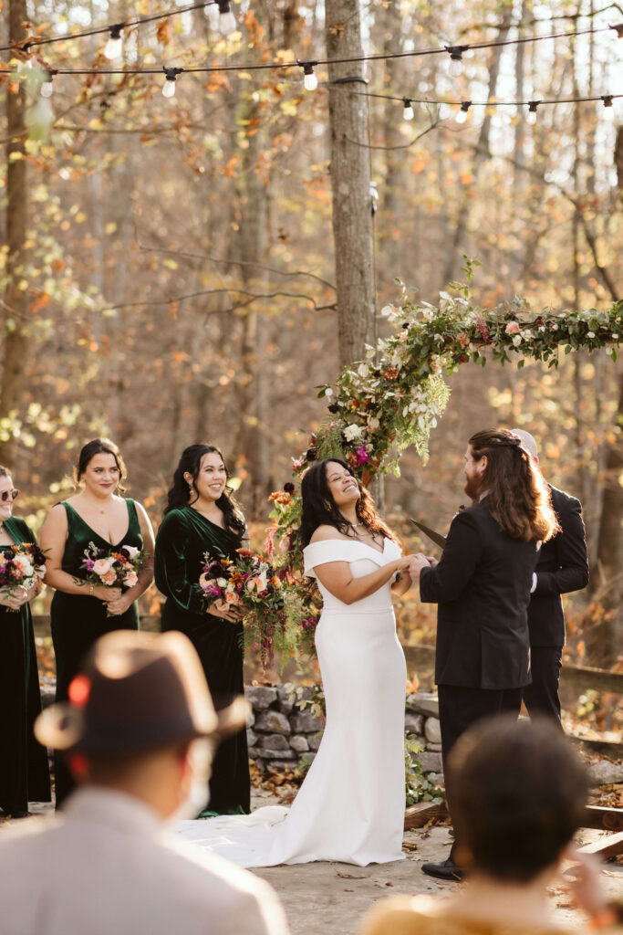 Outdoor autumn wedding ceremony at Oakleaf Cottage. Photo by OkCrowe Photography.