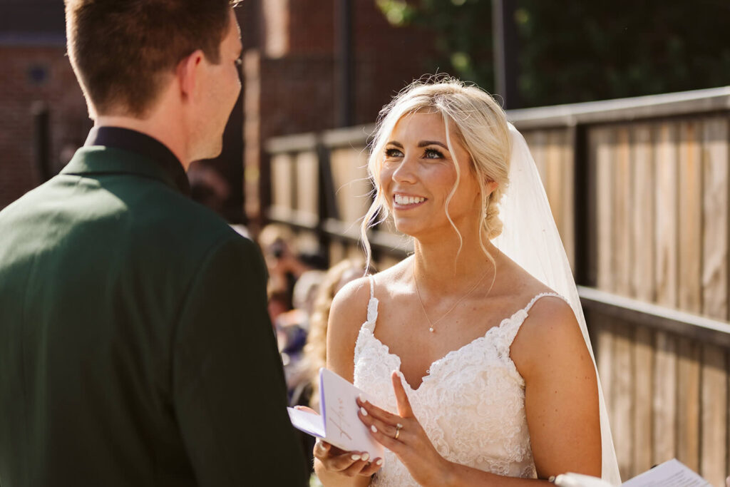 Outdoor wedding ceremony at the Railyard in the Moxy Chattanooga. Photo by OkCrowe Photography.
