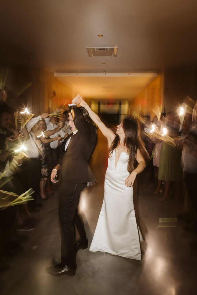 Glow stick send off after a wedding reception at Parkside Hall in Chattanooga. Photo by OkCrowe Photography.