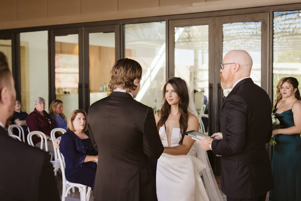 Wedding ceremony on the open-air patio at Parkside Hall in Chattanooga. Photo by OkCrowe Photography.