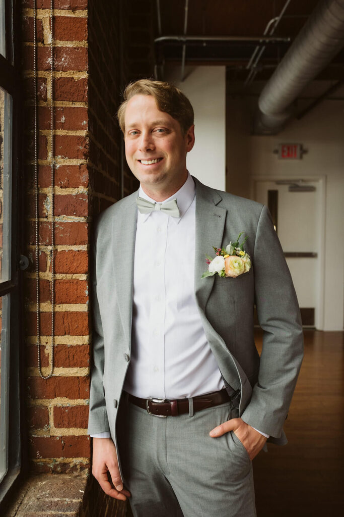 Groom getting ready in the Turnbull Building in Chattanooga. Photo by OkCrowe Photography.