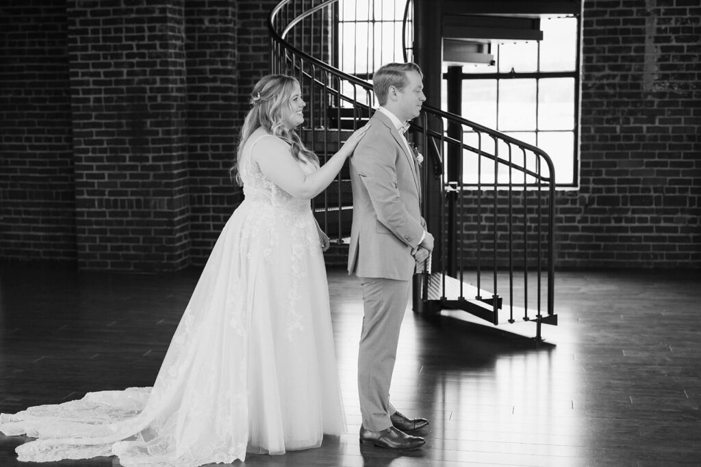 Bride and groom first look in the Turnbull Building in Chattanooga. Photo by OkCrowe Photography.