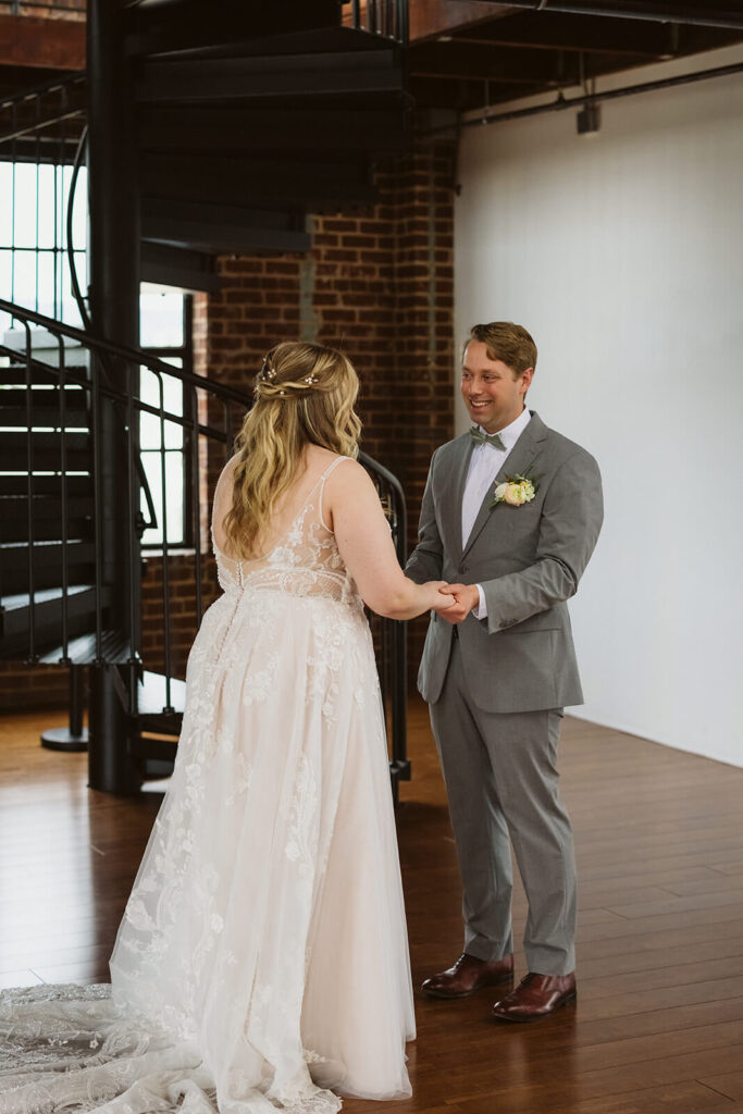 Bride and groom first look in the Turnbull Building in Chattanooga. Photo by OkCrowe Photography.