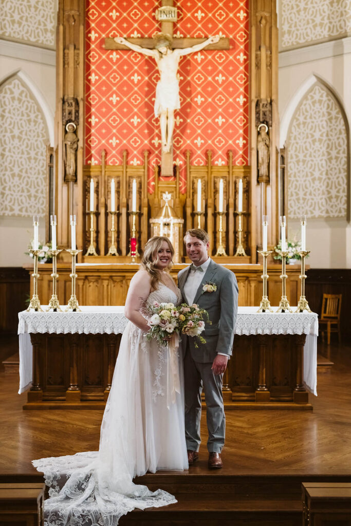 Bride and groom portraits in the Basilica of Saints Peter and Paul in Chattanooga. Photo by OkCrowe Photography.