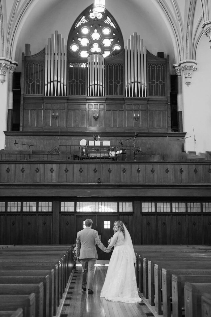 Bride and groom portraits in the Basilica of Saints Peter and Paul in Chattanooga. Photo by OkCrowe Photography.