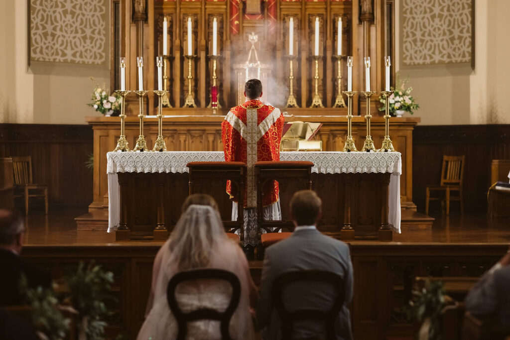 Wedding ceremony at the Basilica of Saints Peter and Paul in Chattanooga. Photo by OkCrowe Photography.