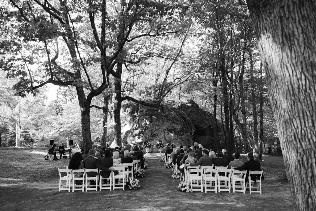 Outdoor wedding ceremony in a rock grotto at the Lookout Mountain Fairyland Clubhouse. Photo by OkCrowe Photography.