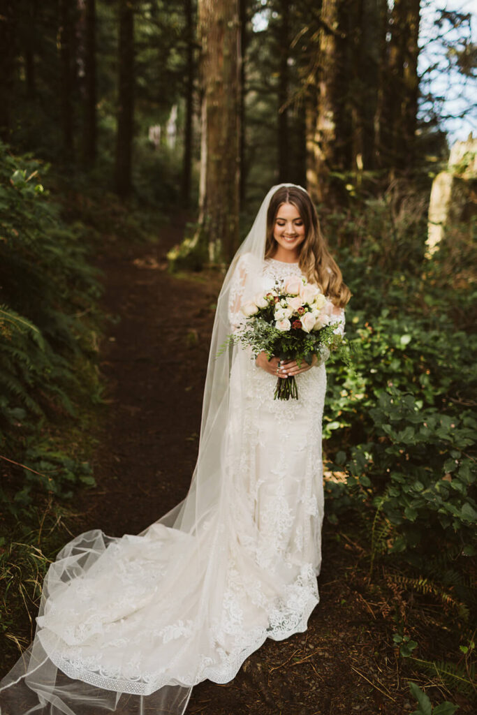 Bridal portraits along the Indian  Trail hiking path in Ecola Park in Cannon Beach, Oregon. Photo by OkCrowe Photography. 
