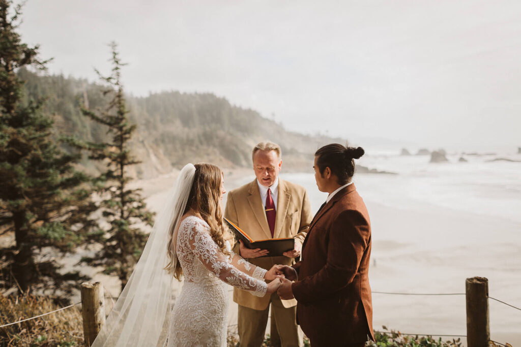 Destination elopement ceremony on the Indian Trail Outlook in Ecola Park in Cannon Beach, Oregon. Photo by OkCrowe Photography.