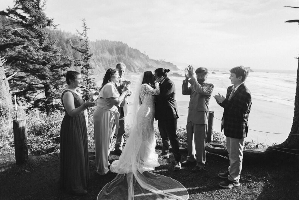 Family and newlyweds portraits after a destination elopement ceremony on the Indian Trail Outlook in Ecola Park in Cannon Beach, Oregon. Photo by OkCrowe Photography.