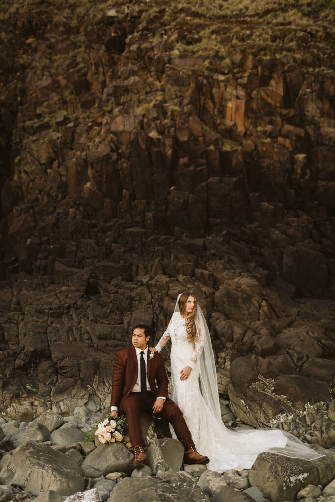 Newlywed portraits by Haystack Rock in Cannon Beach, Oregon. Photo by OkCrowe Photography.