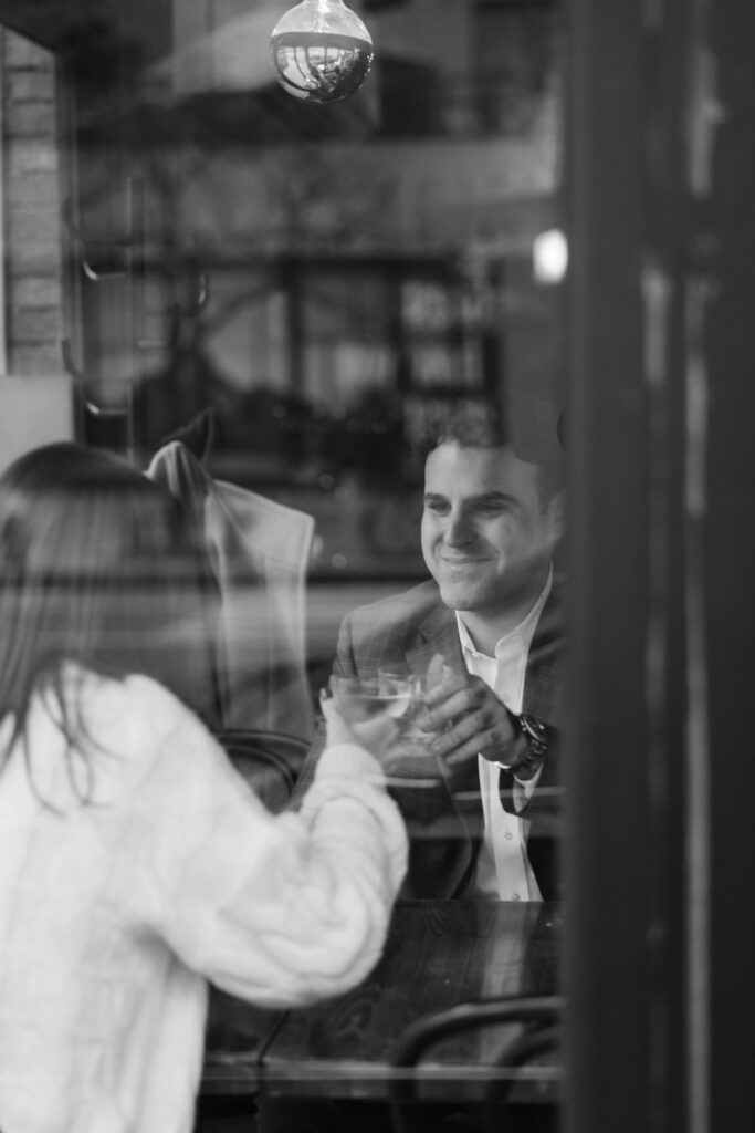 Engagement session dinner date in Au Cheval in downtown Manhattan. Photo by OkCrowe Photography. 