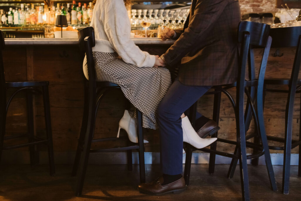 Engagement session dinner date in Au Cheval in downtown Manhattan. Photo by OkCrowe Photography. 