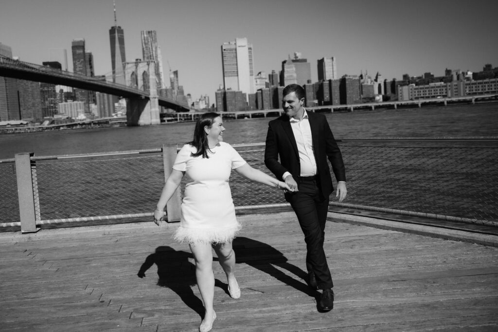 Engagement session with the Manhattan skyline in Brooklyn Bridge Park in DUMBO Brooklyn, NYC. Photo by OkCrowe Photography. 