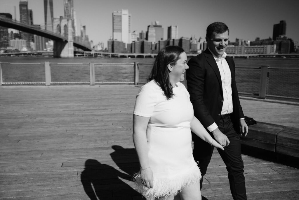 Engagement session with the Manhattan skyline in Brooklyn Bridge Park in DUMBO Brooklyn, NYC. Photo by OkCrowe Photography. 