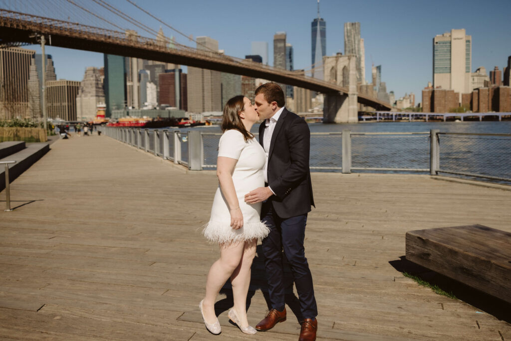 Engagement session with the Manhattan skyline in Brooklyn Bridge Park in DUMBO Brooklyn, NYC. Photo by OkCrowe Photography. 