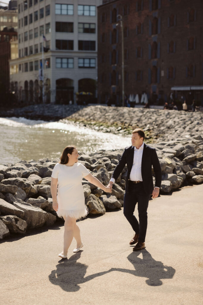 Engagement session with the Manhattan skyline in Brooklyn Bridge Park in DUMBO Brooklyn, NYC. Photo by OkCrowe Photography. 