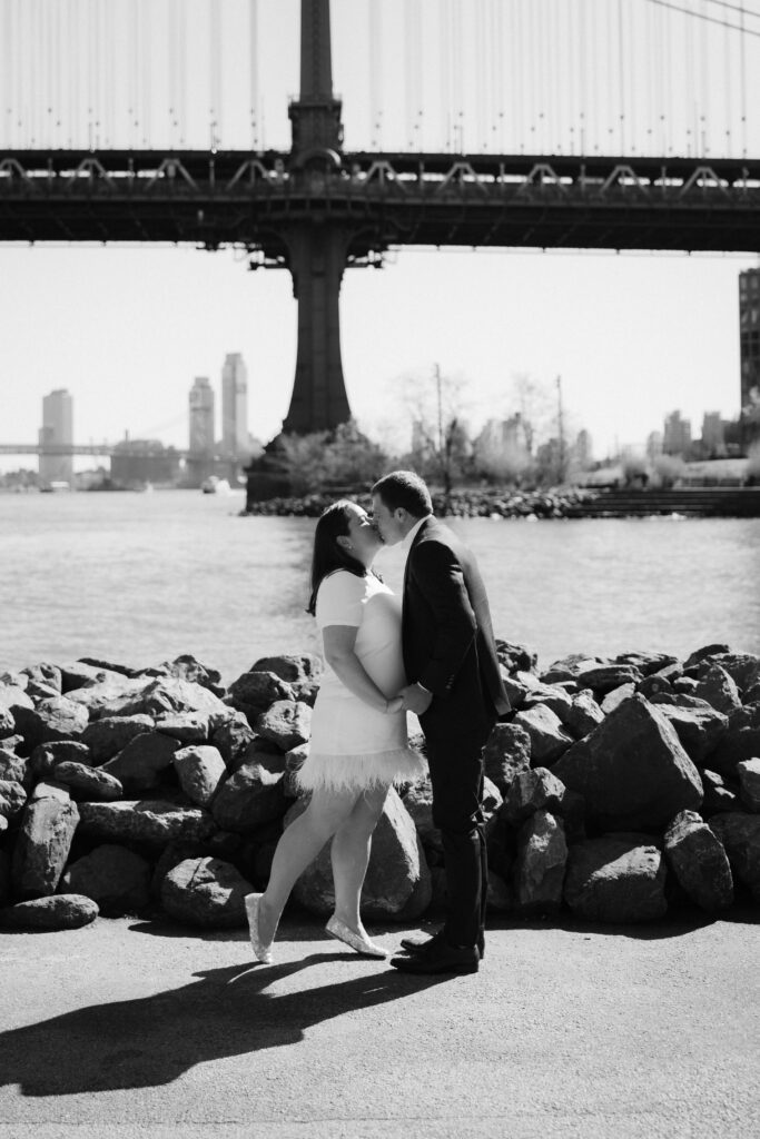 Engagement session with the Manhattan skyline in Brooklyn Bridge Park in DUMBO Brooklyn, NYC. Photo by OkCrowe Photography. 