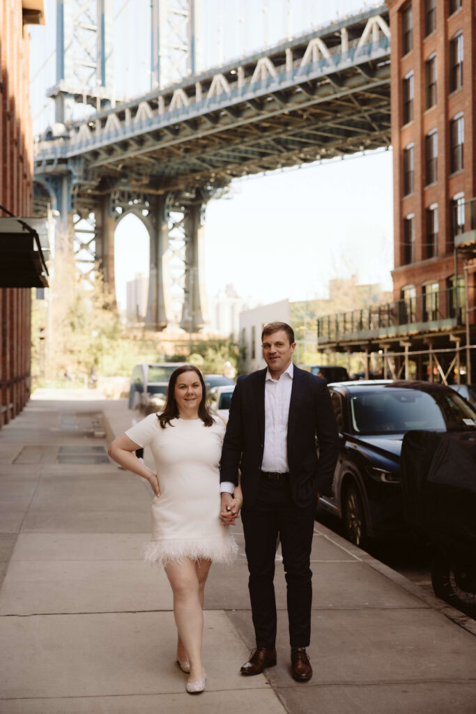 Engagement session on Washington Street between Water and Front Street with the Manhattan Bridge in DUMBO Brooklyn, NYC. Photo by OkCrowe Photography. 