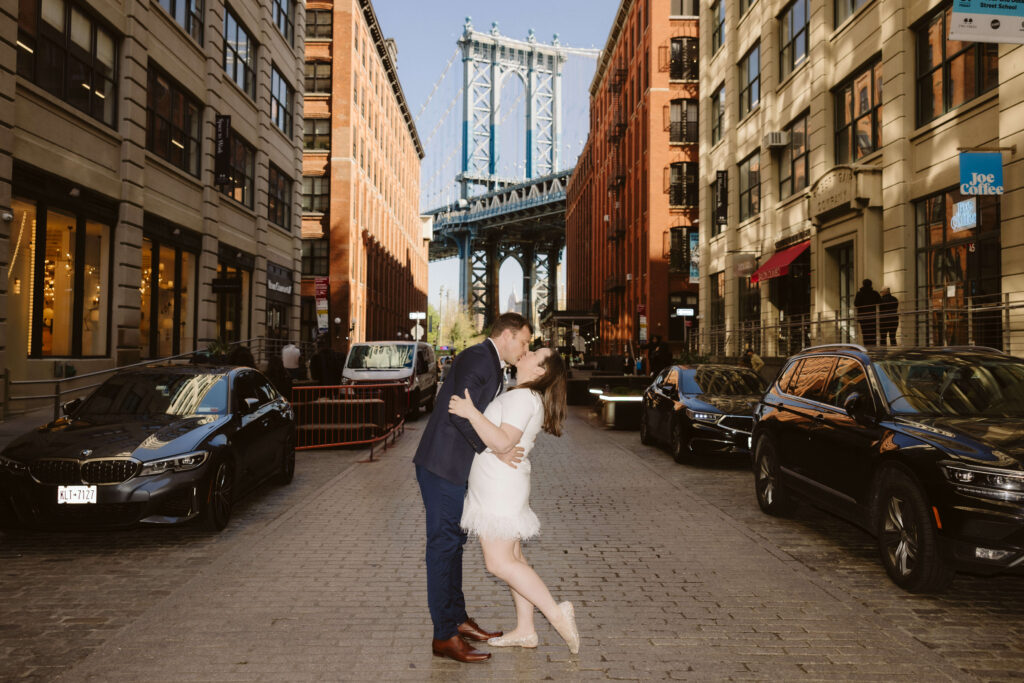 Engagement session on Washington Street between Water and Front Street with the Manhattan Bridge in DUMBO Brooklyn, NYC. Photo by OkCrowe Photography. 