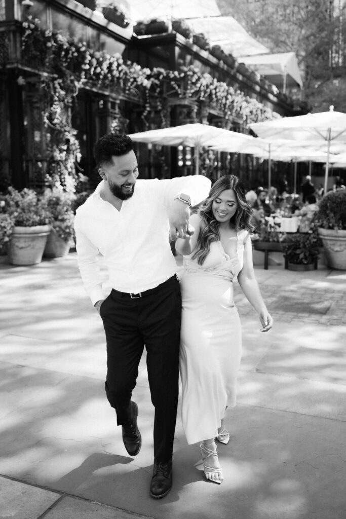 Spring engagement session by the Bryant Park Grill in Bryant Park, NYC. Photo by OkCrowe Photography.