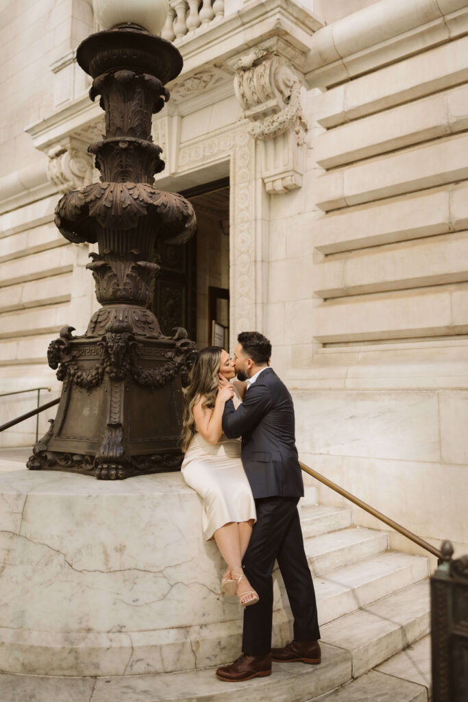 Spring engagement session outside the New York Public Library. Photo by OkCrowe Photography.