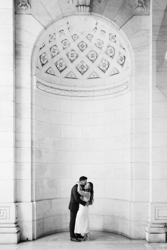 Spring engagement session outside the New York Public Library. Photo by OkCrowe Photography.