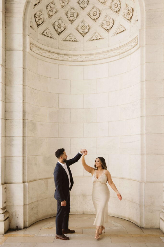 Spring engagement session outside the New York Public Library. Photo by OkCrowe Photography.