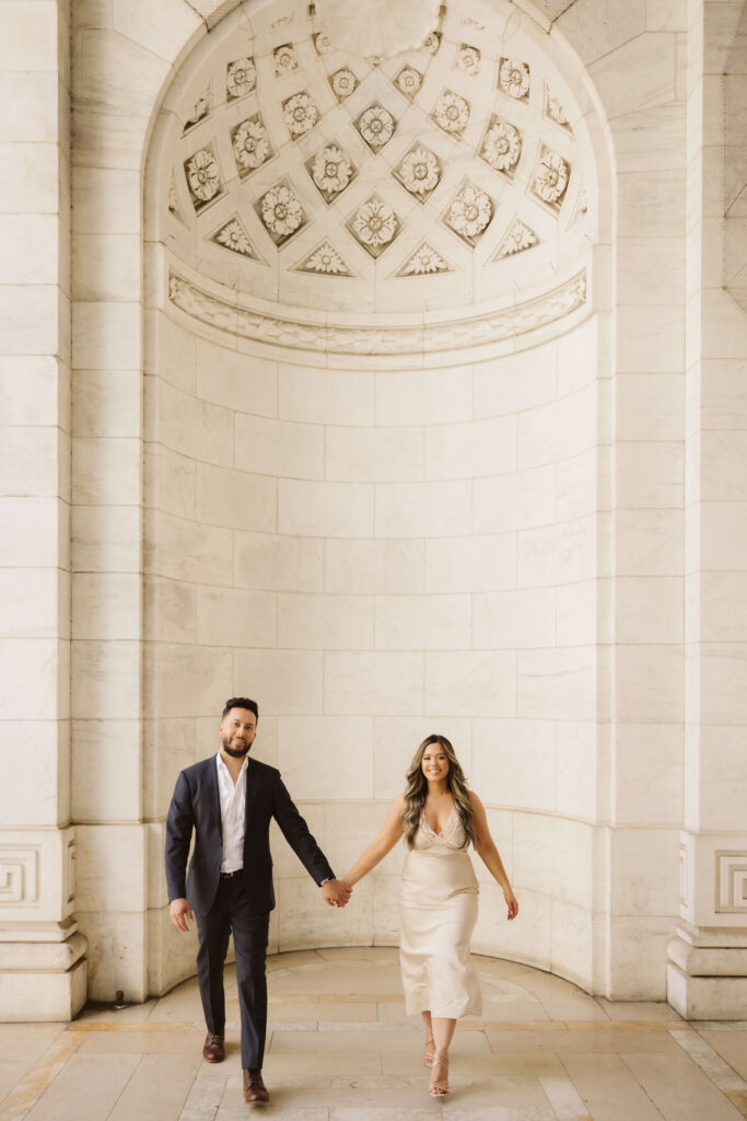 Spring engagement session outside the New York Public Library. Photo by OkCrowe Photography.