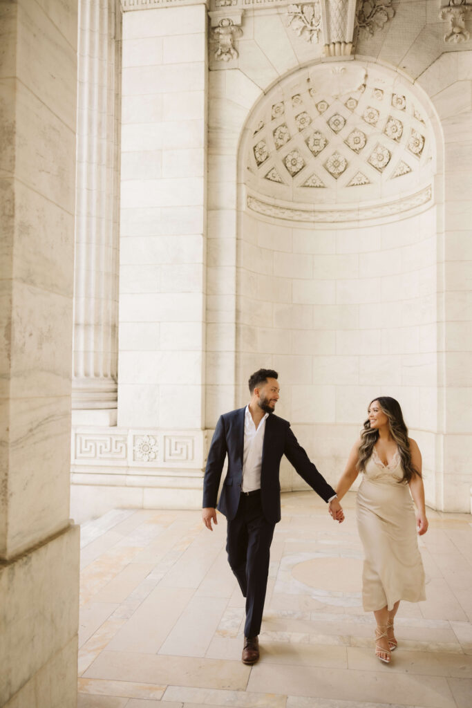 Spring engagement session outside the New York Public Library. Photo by OkCrowe Photography.