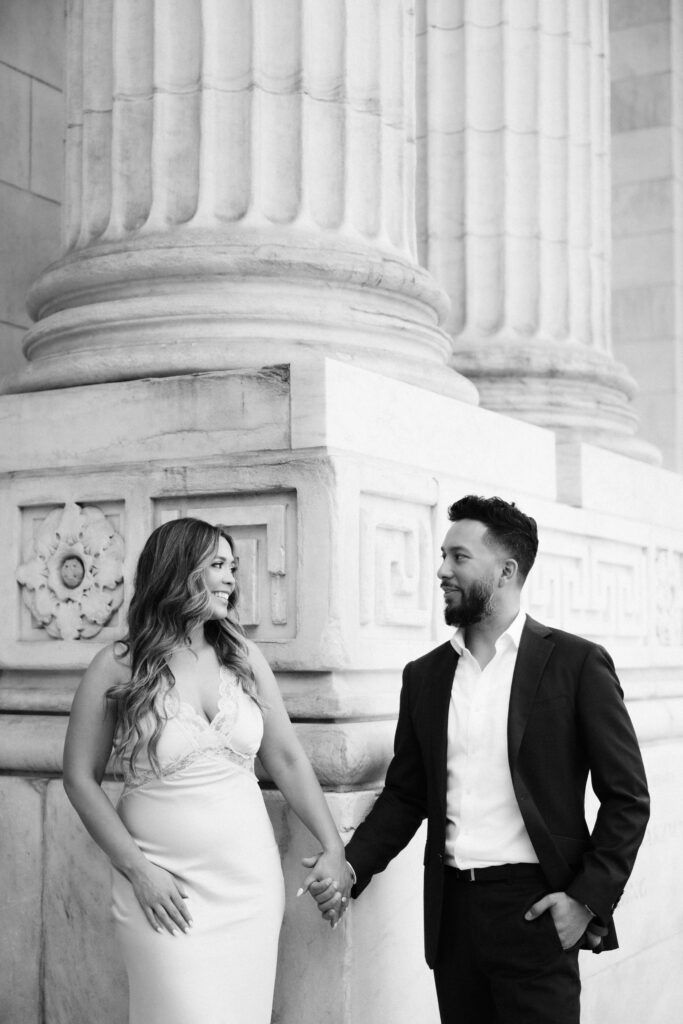 Spring engagement session outside the New York Public Library. Photo by OkCrowe Photography.