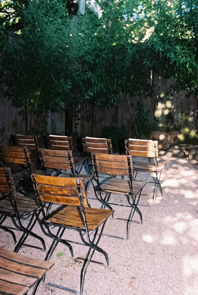 Backyard-style wedding ceremony in Frankies Spuntino's outdoor Garden space. Photo by OkCrowe Photography.