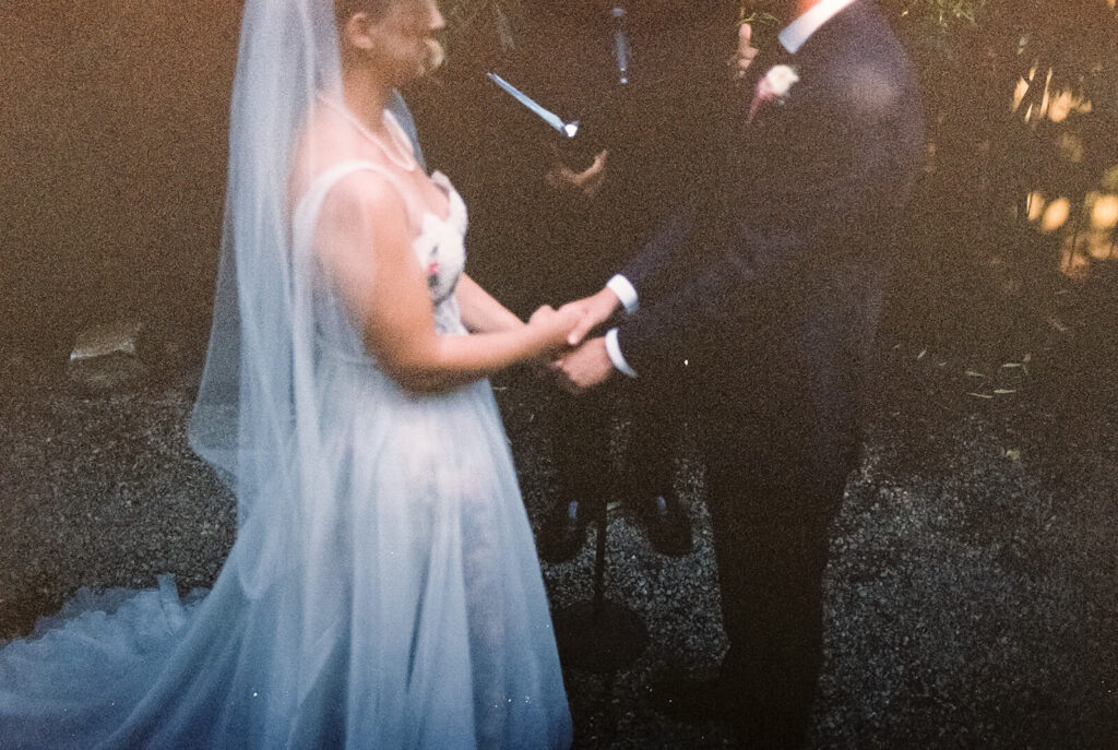 Backyard-style wedding ceremony in Frankies Spuntino's outdoor Garden space. Photo by OkCrowe Photography.