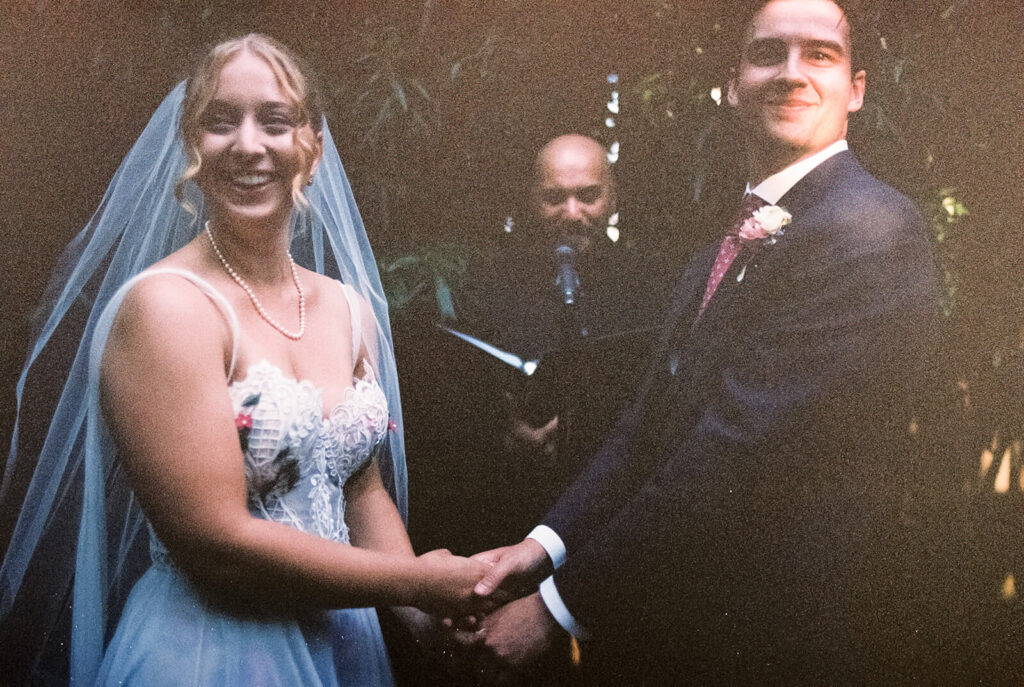 Backyard-style wedding ceremony in Frankies Spuntino's outdoor Garden space. Photo by OkCrowe Photography.