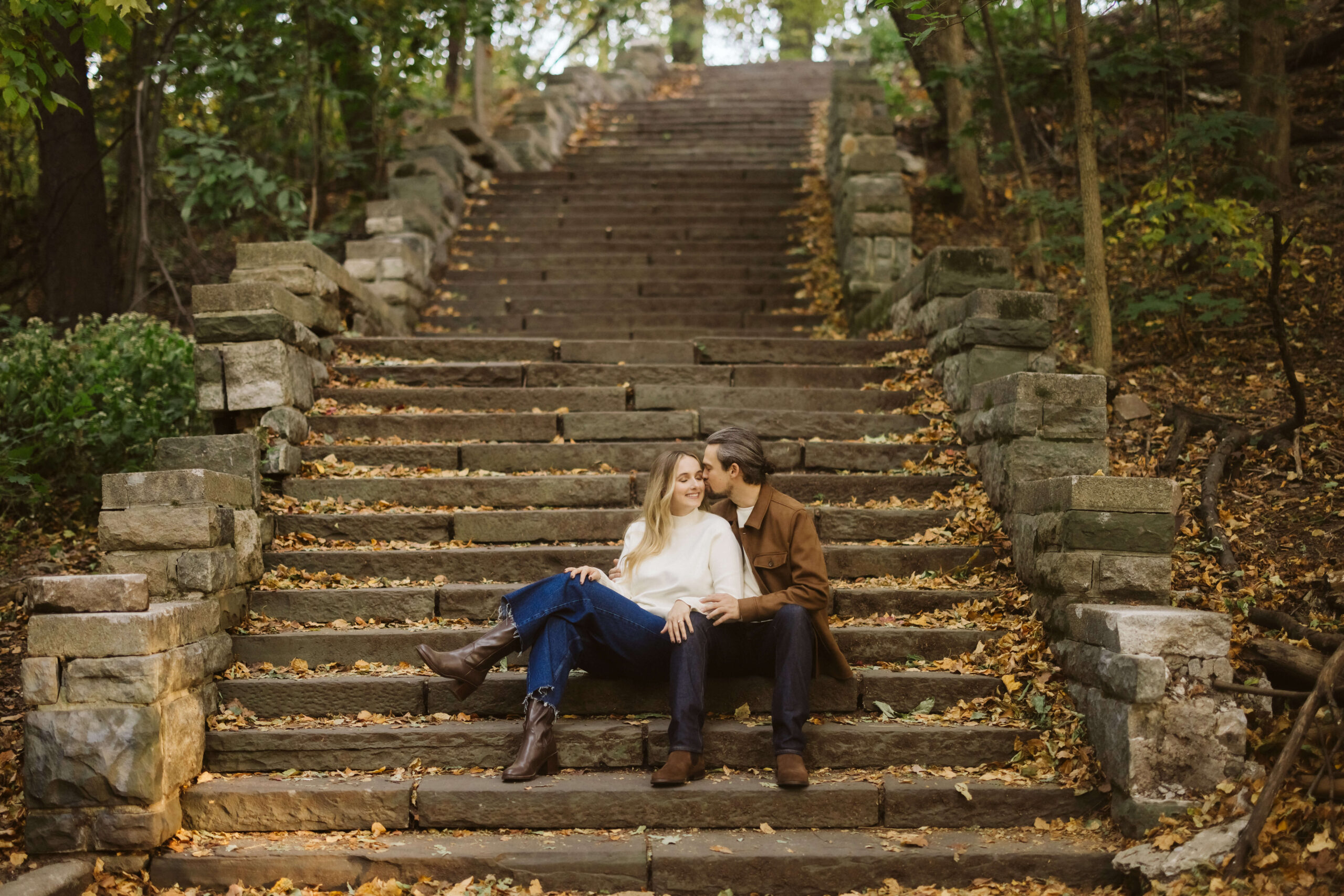 Couple in Central Park in the fall during their NYC engagement session. Photo by OkCrowe Photography. 