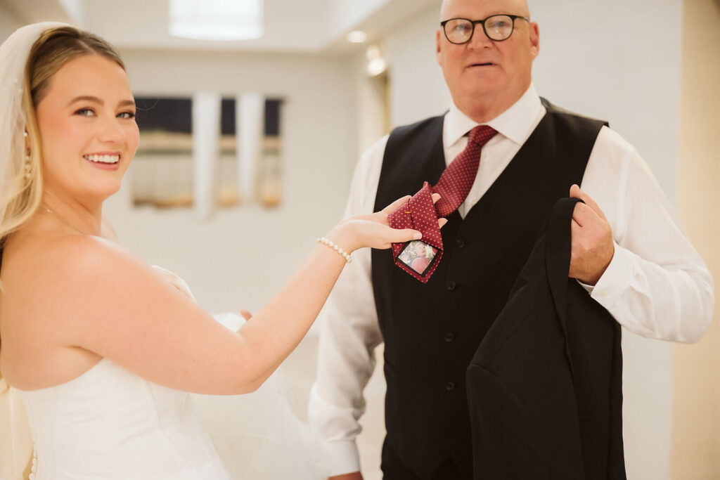 Father-Daughter First Look in an AirBnB for a wedding at the New York Botanical Gardens. Photo by OkCrowe Photography.