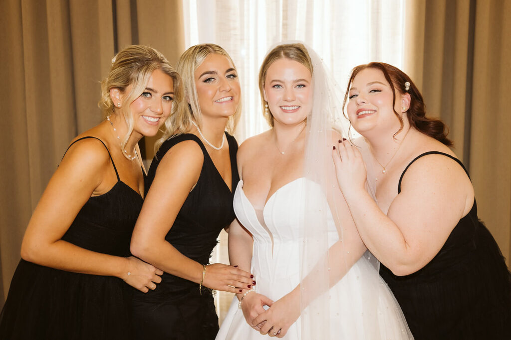 Bridesmaids First Look in an AirBnB for a wedding at the New York Botanical Gardens. Photo by OkCrowe Photography.