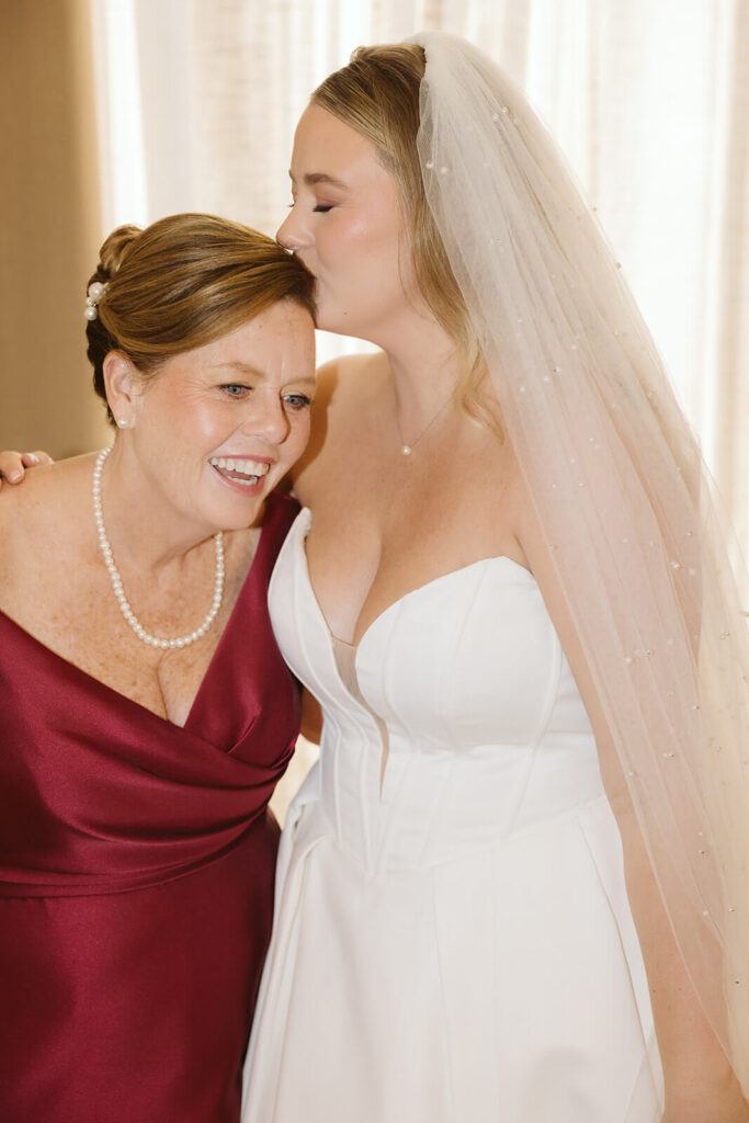 Portrait of a bride and her mother in an AirBnB for a wedding at the New York Botanical Gardens. Photo by OkCrowe Photography.