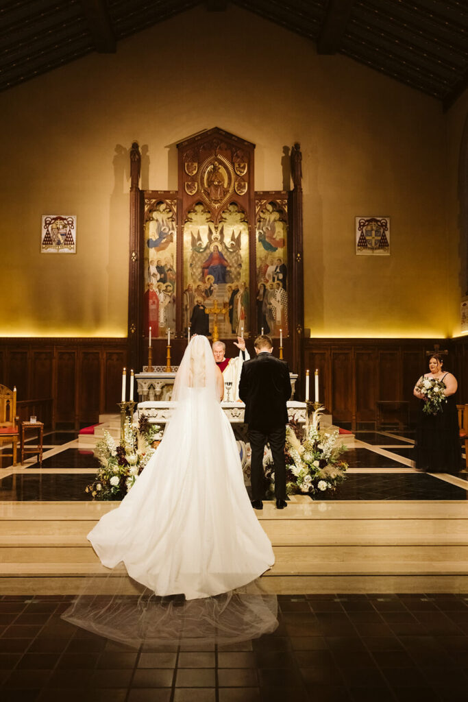 Wedding ceremony at the Fordham University Church. Photo by OkCrowe Photography.