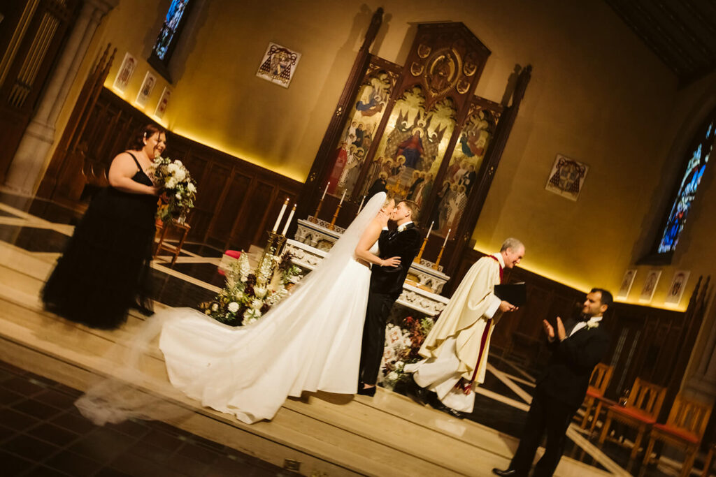 Wedding ceremony at the Fordham University Church. Photo by OkCrowe Photography.
