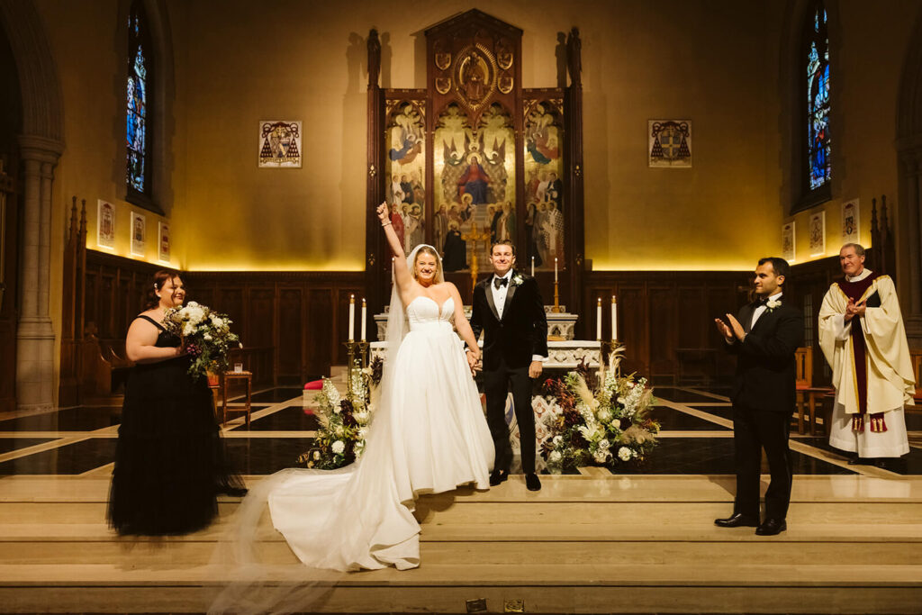 Wedding ceremony at the Fordham University Church. Photo by OkCrowe Photography.